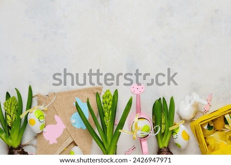 Easter background with hyacinths, Easter decor and decorative watering can on a light background with space for text. Top view, advertising card, postcard. Easter concept