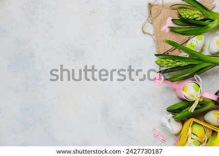 Easter background with hyacinths, Easter decor and decorative watering can on a light background with space for text. Top view, advertising card, postcard. Easter concept
