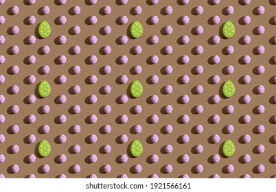 Easter background. Seamless pattern. Holiday ornament. Green pink painted spotted egg shape minimal symmetrical composition isolated on brown abstract banner.