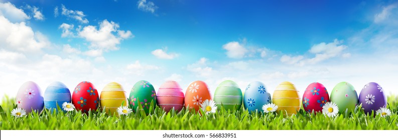 Easter Banner - Colorful Painted Eggs In Row On Grass
