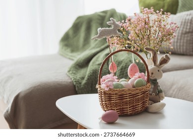 Easter Basket with Ester Eggs,  Plush Bunny and Spring Decor on White Table intoCozy Living Room