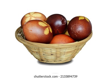 Easter basket full of cracked Easter eggs isolated on white background                               