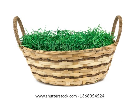 easter basket with grass isolated on white background