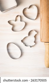 Easter Biscuit Cutter: Rabbit, Chicken, Egg, Heart  And Dough Roll On White Wooden Background, Top View, Place For Text