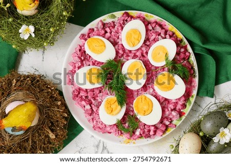Easter boiled eggs on beetroot dip. A traditional Polish appetizer on Easter background..top veiw.selective focus