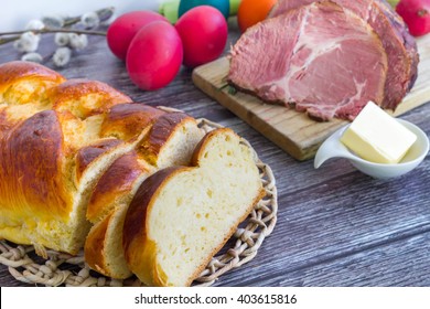 Easter Braided Bread With Ham And Colorful Boiled Eggs.