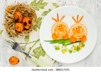 Easter Breakfast For Kids. Funny Idea For Baby Healthy Shaped Animals Food Cute Chick From Cheese Crackers Green Onion And Vegetables Top View