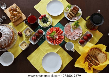 Easter breakfast table in Poland with chalka bread. Easter foods in Europe.