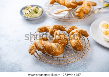 Easter brunch with bread bunny bun, egg spread and hard boiled eggs