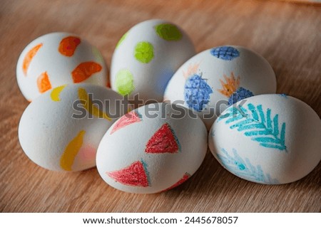 Easter bunny hunt. Spring holiday at Sunday. Eastertide and Eastertime. Good Friday. Hunting eggs. Painted eggs. Easter eggs on wooden table. Happy Easter holiday celebration. Hidden Easter eggs.