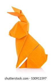 Easter bunny of orange origami. Isolated on white background