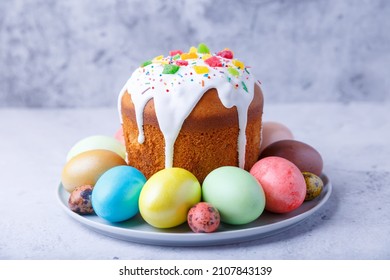 Easter cake with candied fruits and colored eggs. Traditional Easter baking. Easter holiday. Close-up.