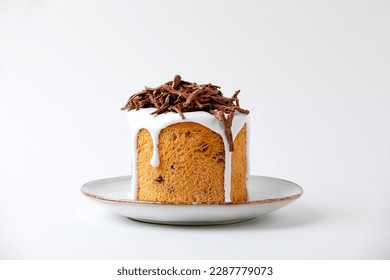 Easter Cake Kulich, Decorated Icing And Chocolate Crumb On Plate Isolated On White Background. Side View. Copy Space.