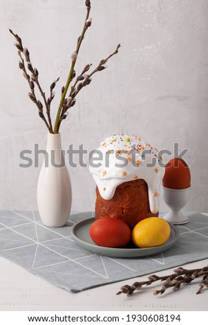 Easter cake on a light background with eggs and and a willow tree Christianity Orthodoxy composition
