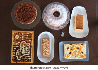 Easter Cakes Table In Poland. Easter Pastry: Baba Cake, Mazurek Cakes And Cheesecakes. Easter In Poland - Wielkanoc.