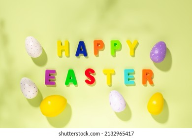 Easter Card. Multicolored Letters Making The Words Happy Easter And Colorful Eggs. Top View