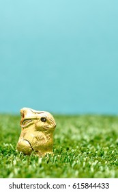 An Easter Chocolate Bunny Wrapped In Gold Paper 