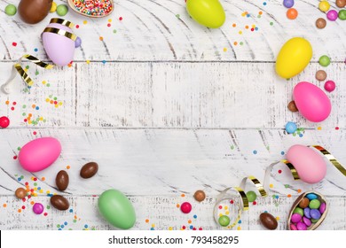 Easter Chocolate Egg And Colorful Candy Sprinkles On White Background. Copy Space