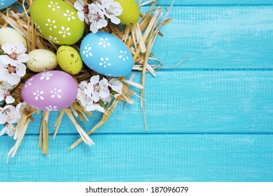 Easter composition with flowering branches on wooden table close-up