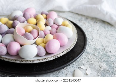 Easter composition with mini chocolate eggs in pastel colors