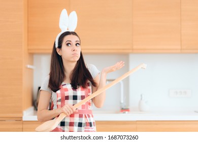 Easter Cook With Bunny Ears And Huge Wooden Spoon. Party Host Stressed About Organizing Holiday Party 
