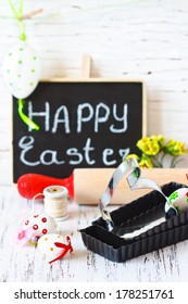 Easter Cooking. Bunny Cookie Cutter, Rolling Pin And Colorful Chocolate Eggs.