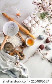 Easter culinary background. Easter food ingredients composition on the kitchen table and copy space for a text menu or recipe - Shutterstock ID 2134896657