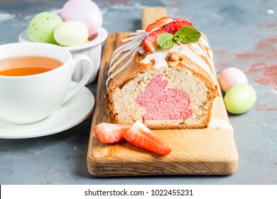 Easter cupcake with Easter Bunny, tea Cup and Easter eggs. Breakfast.