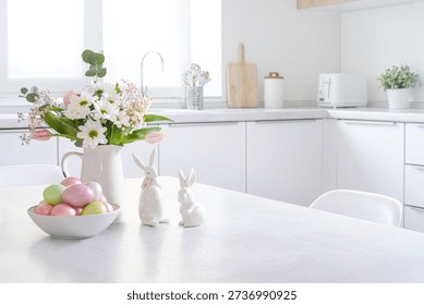 Easter decorations on table with copy space and modern kitchen counter interior