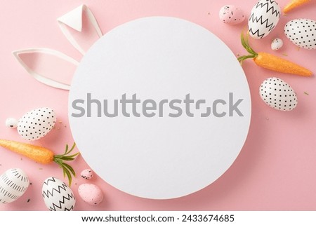 Easter design idea: Overhead shot of creative colored eggs, cute bunny ears, carrot decorations, and colorful sprinkles on a soft pink surface, featuring a blank circular space for messages or ads