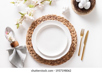 Easter Dinner With Eggs, Bunny, Festive Tableware And Blooming Spring Flowers On White Table. Top View.