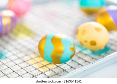 Easter Egg Coloring. Painting Easter Eggs With Gold Luster.