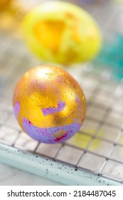 Easter Egg Coloring. Painting Easter Eggs With Gold Luster.