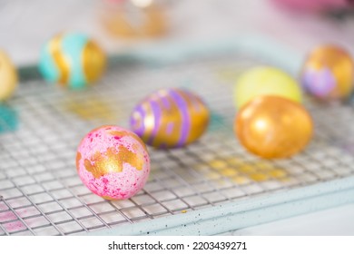 Easter Egg Coloring. Painting Easter Eggs With Gold Luster.