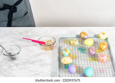 Easter Egg Coloring. Painting Easter Eggs With Gold Luster.