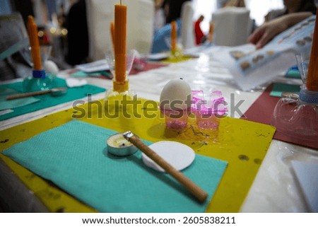 Easter egg decorating workshop setup with traditional tools and instructions in Ternopil, Ukraine, March 30, 2025 – Ukrainian pysanka craft education