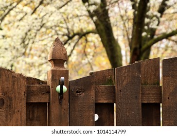 Easter Egg Hunt - Green Egg Is Resting Inside A Metal Planter Hook