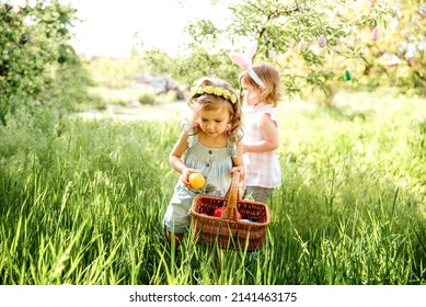 Easter egg hunt. Group Of Children Wearing Bunny Ears Running To Pick Up colorful Egg On Easter Egg Hunt In Garden. Easter tradition - Powered by Shutterstock