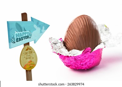 Easter Egg Hunt Sign Against Easter Egg Unwrapped In Pink Foil