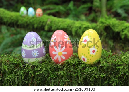 Easter egg in a mossy forest.