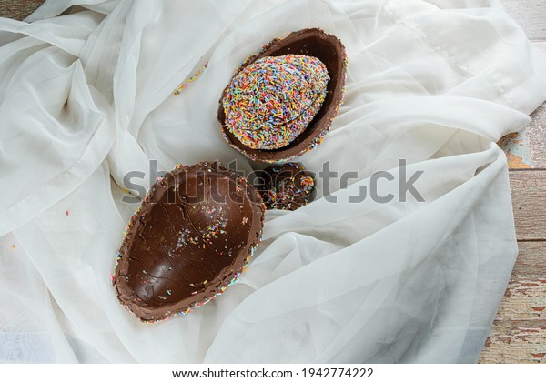 Easter egg stuffed with\
another egg covered with colorful chocolate sprinkles (Pinata\
Easter egg).