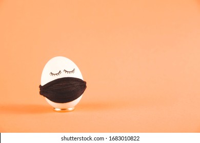 Easter eggs with Corona virus COVID19 protection concepts. Easter eggs wearing mask for Easter holidays decoration. On a peach background with copyspace. - Powered by Shutterstock