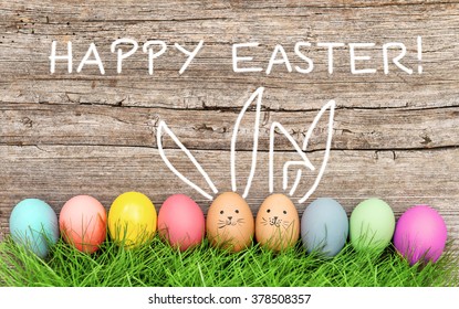 Easter eggs and cute bunny in green grass. Festive decoration. Happy Easter! - Shutterstock ID 378508357