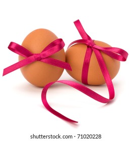 Easter eggs with festive bow isolated on white background