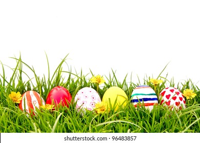 Easter Eggs with flower on Fresh Green Grass over white background - Powered by Shutterstock