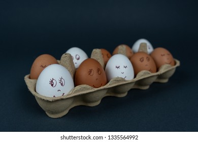 Easter eggs with funny faces in carton box isolated on black background. Spring and Easter holiday greeting concept. - Powered by Shutterstock