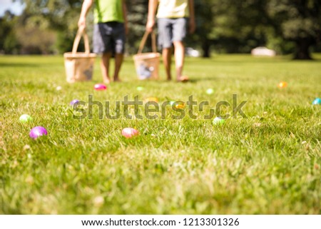 easter eggs hunt. Blurred silhouettes of children with baskets in hands. the concept of family fun at Easter.  blurred background. Cope space for your text