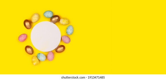 Easter eggs making a frame around a copyspace .