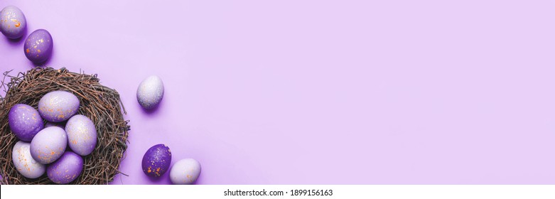 Easter eggs in nest on purple background. Flat lay, top view. - Powered by Shutterstock