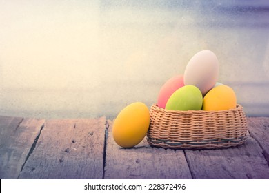 Easter Eggs In The Nest On Rustic Wooden Background